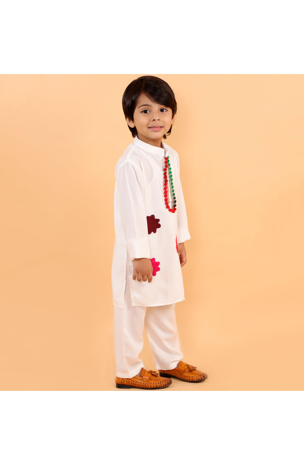 White holi kurta with colorful patches and white pyjama
