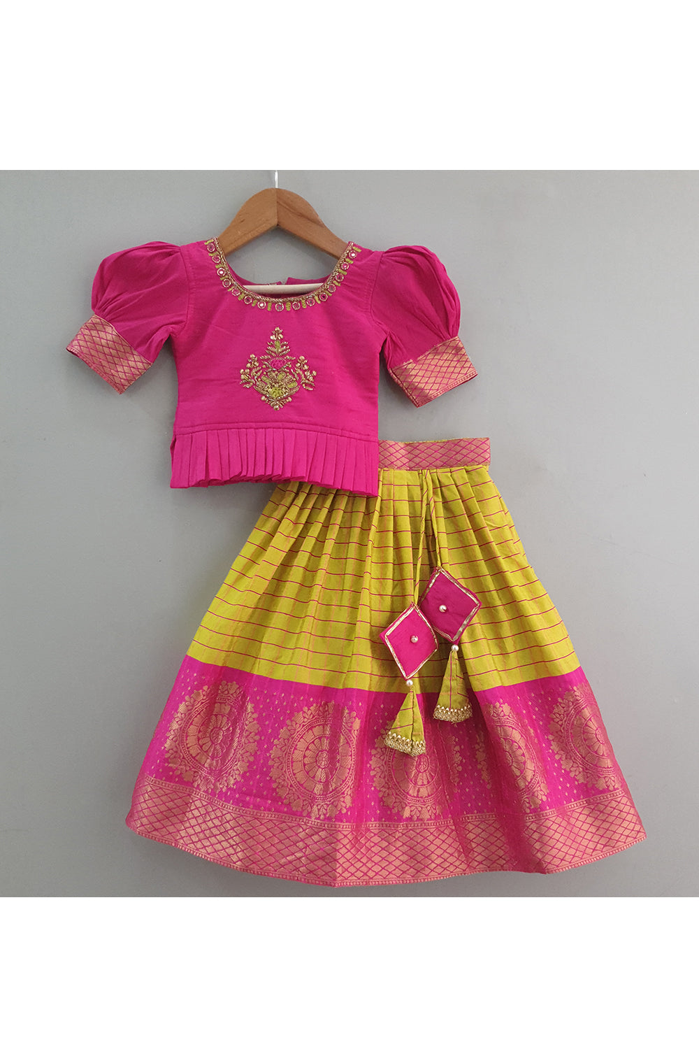 Fuchsia pink hand embroidered peplum choli with lehenga