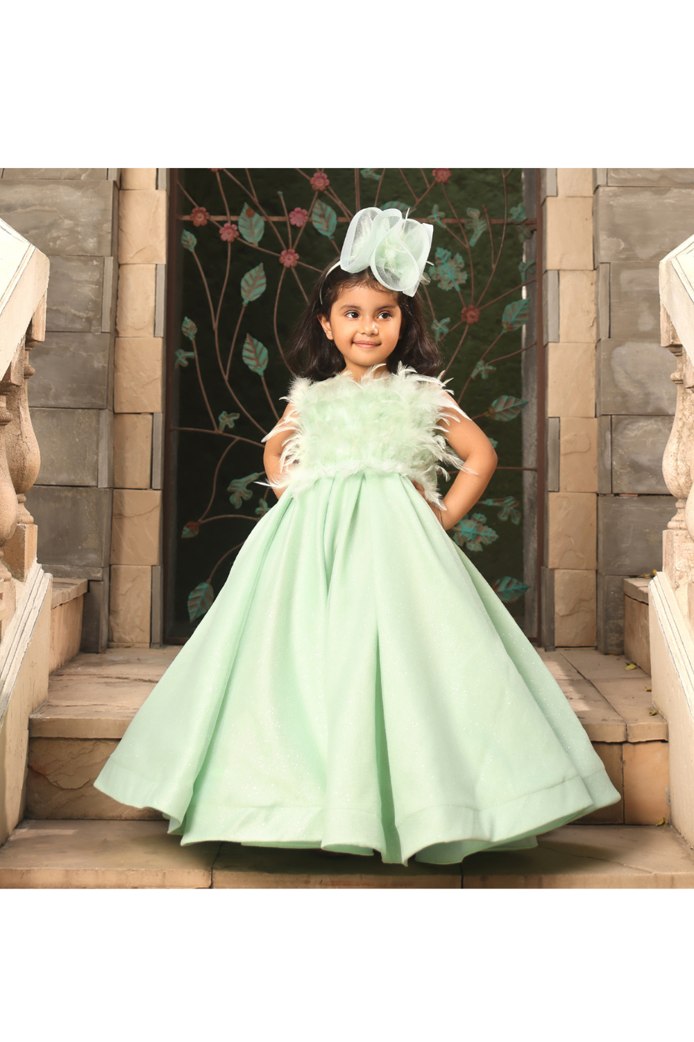 Pista Green Feathers And Bow Embellished Net Gown