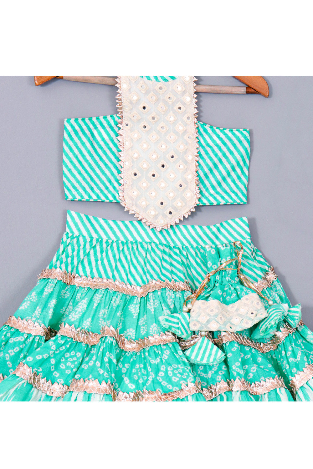 Blue Bandhani Printed Halter Neck Top With Lace Detailing Layered Mid Calf Lehenga Set