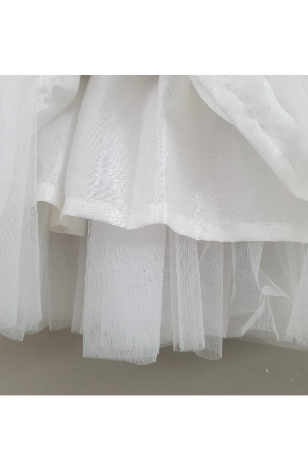 White Embroidered Sleeveless Top With Net Lehenga Set