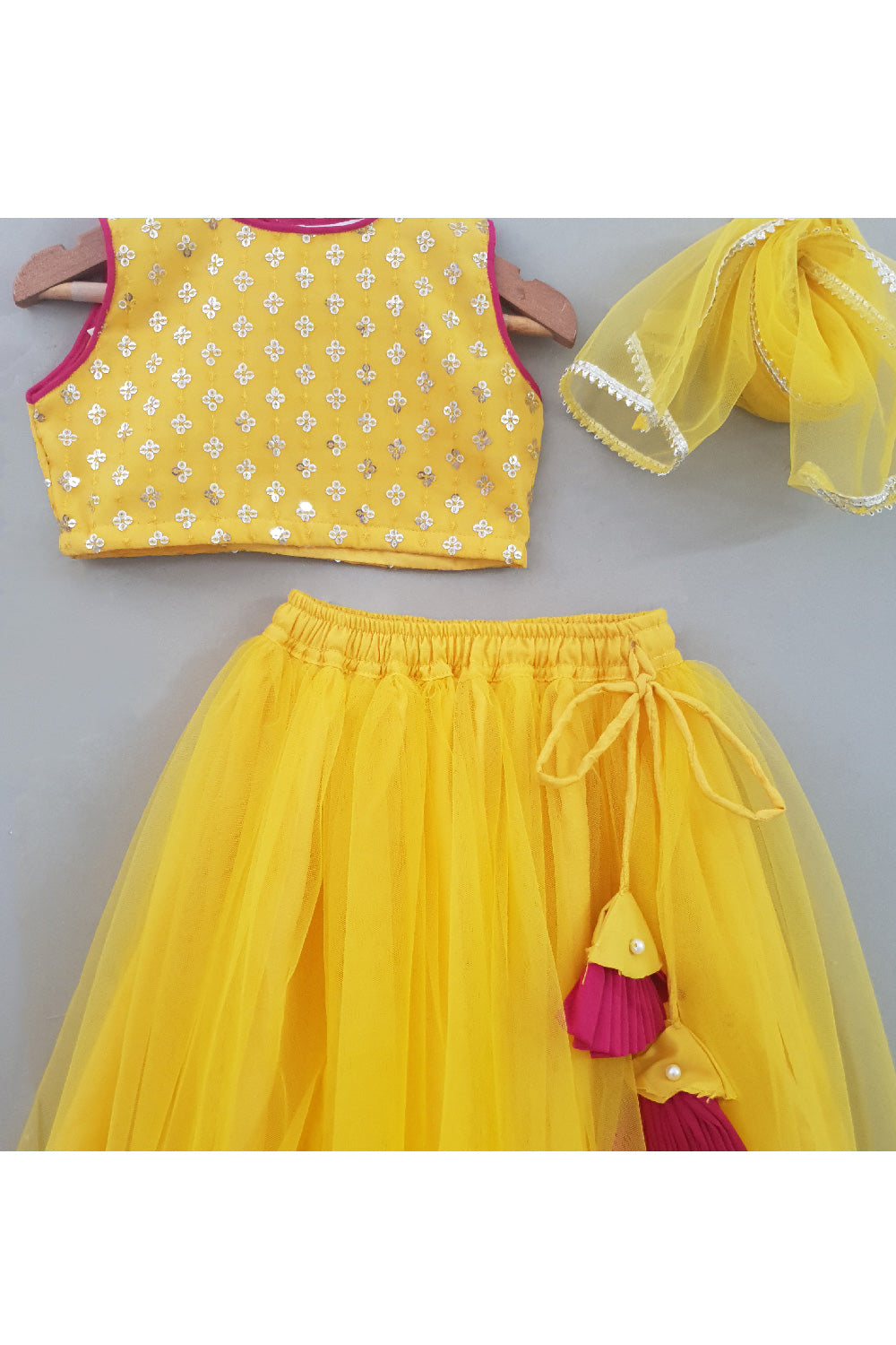 Yellow Embroidered Sleeveless Top With Net Lehenga Set