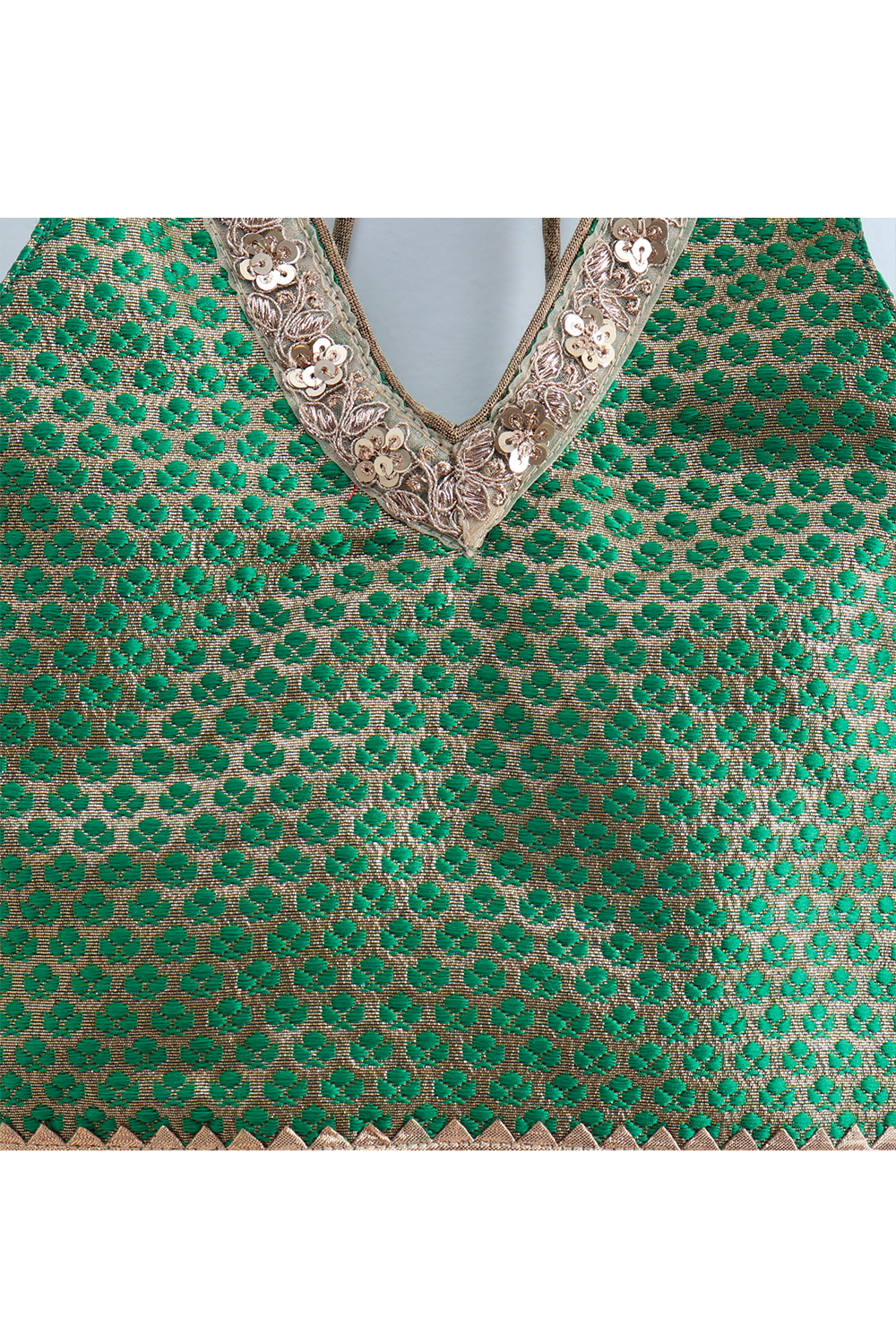 Green brocade halter neck top and red printed palazzo