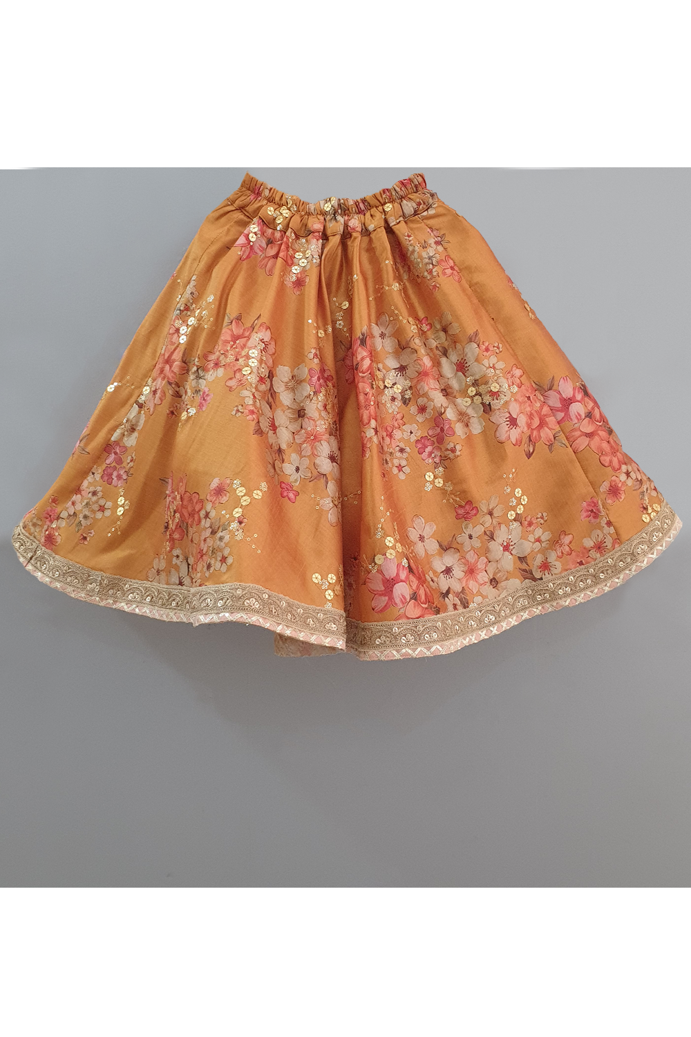 Golden beige top with attached dupatta and mustard floral lehenga