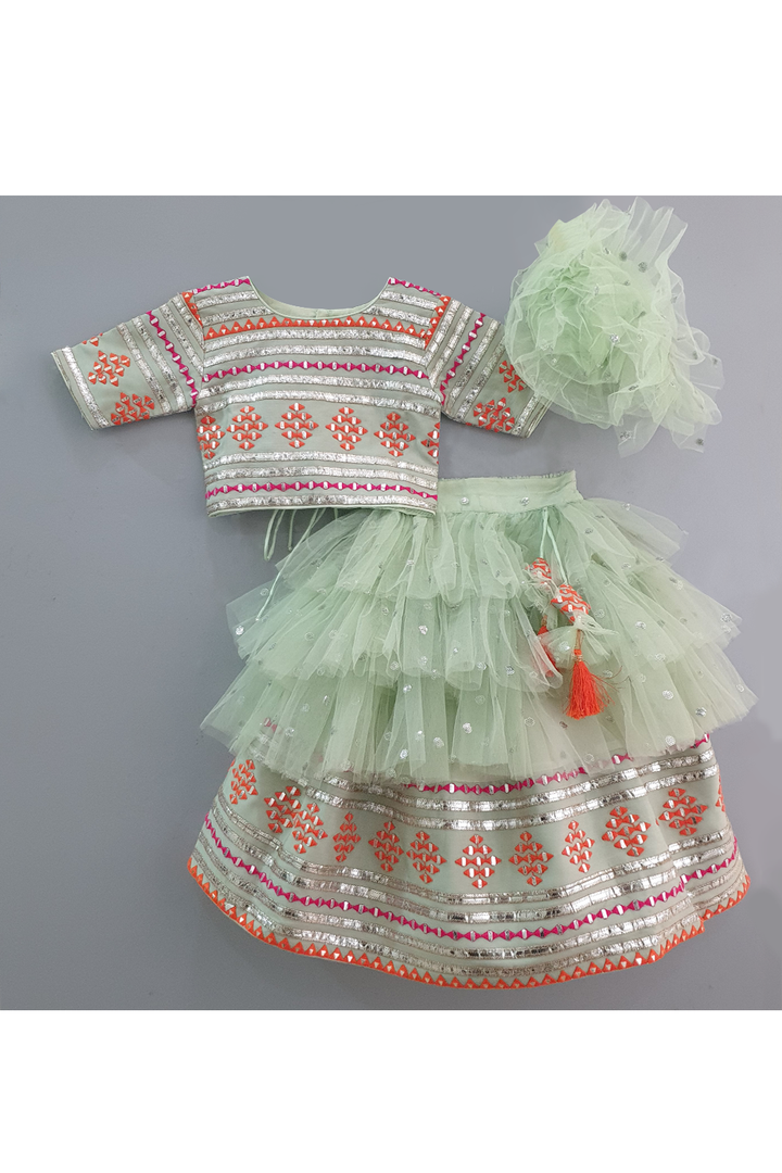 Sea green embroidered choli and lehenga with frilly dupatta