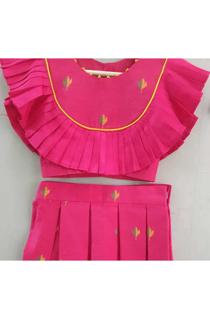 Magenta pink booti frill detailing top and pleated skirt with hair accessory