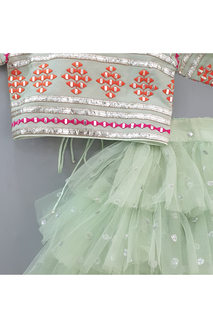 Sea green embroidered choli and lehenga with frilly dupatta