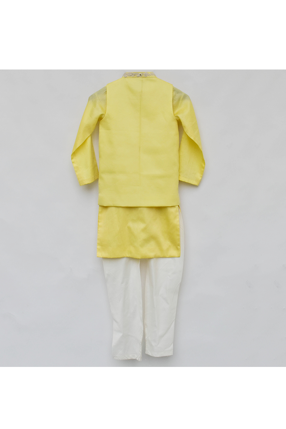 Yellow silk kurta with nehru jacket and white pyjama