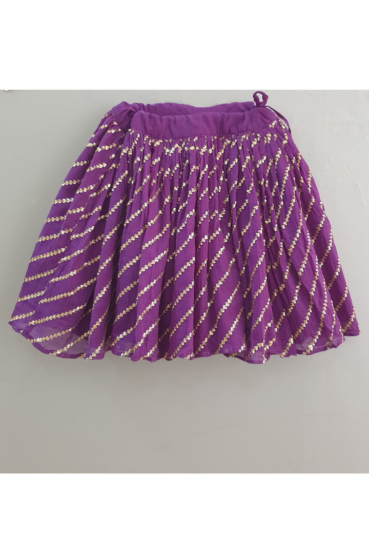 Red smocked tuck top with purple sequined ghagra