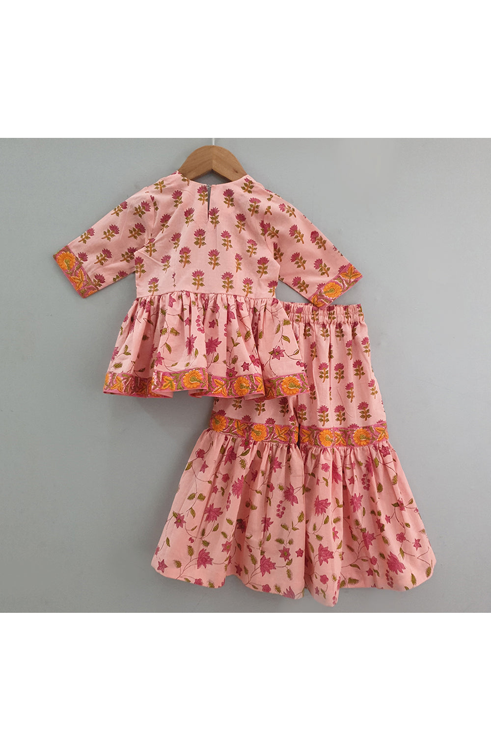 Peach hand block printed peplum style top with sharara set