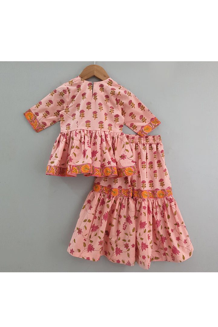 Peach hand block printed peplum style top with sharara set