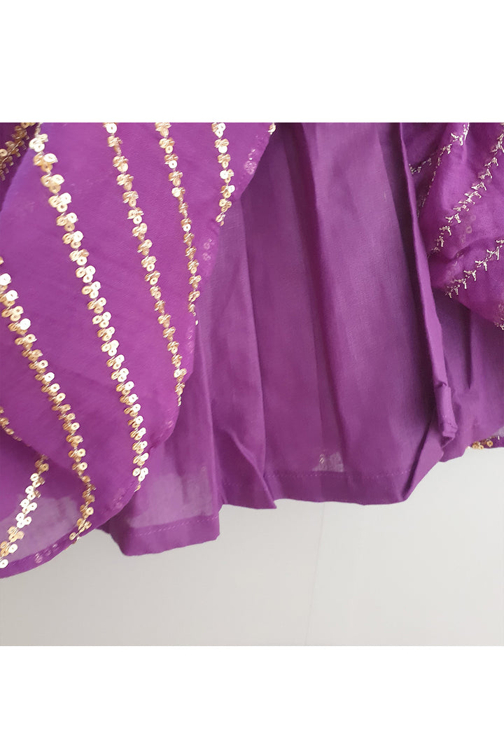 Red smocked tuck top with purple sequined ghagra