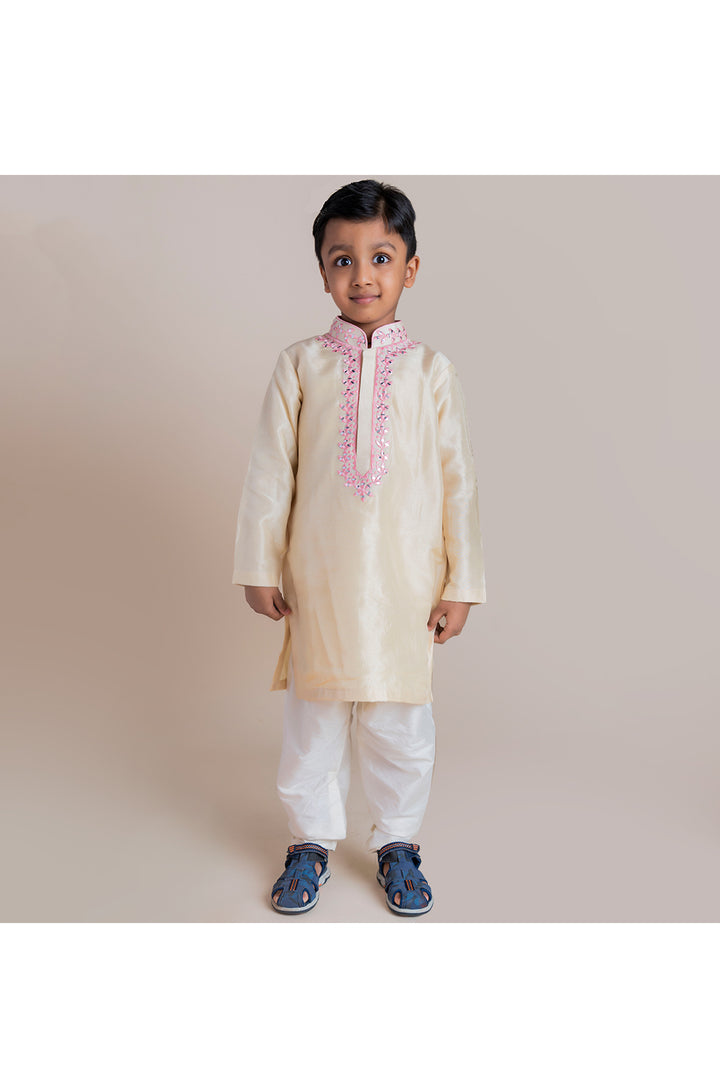 Beige mirror work kurta with white churidar