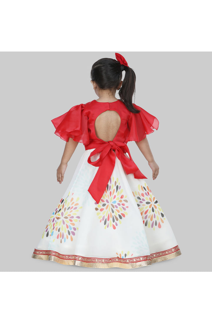 Red frilly sleeves top and printed lehenga with a sling bag