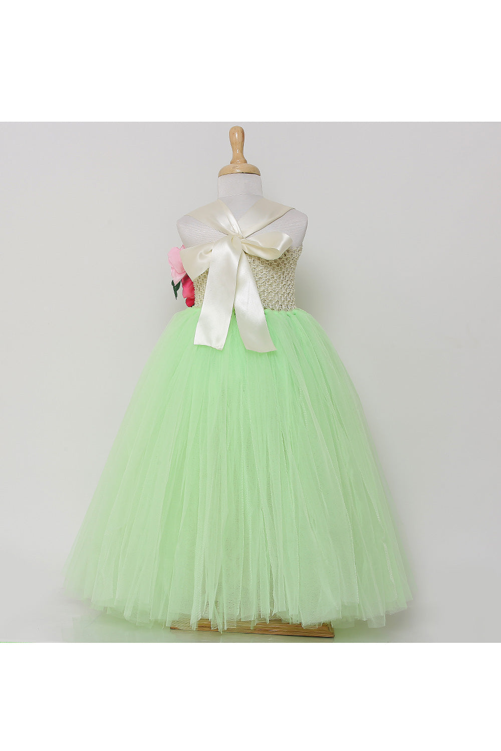 Neon green tutu gown with flowers on one side