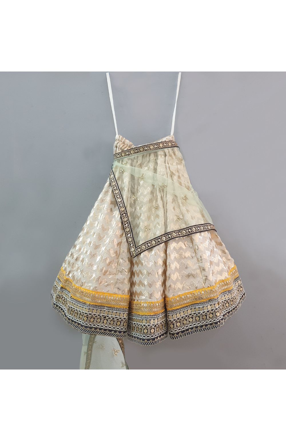 Yellow choli and off white lehenga with attached dupatta