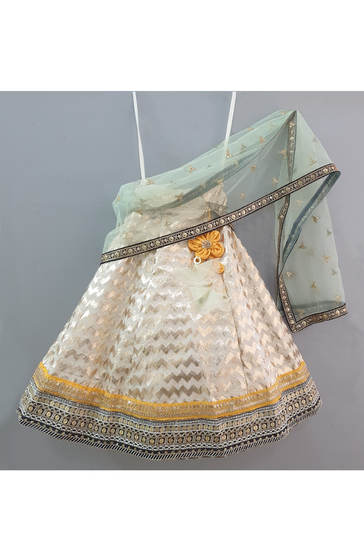 Yellow choli and off white lehenga with attached dupatta