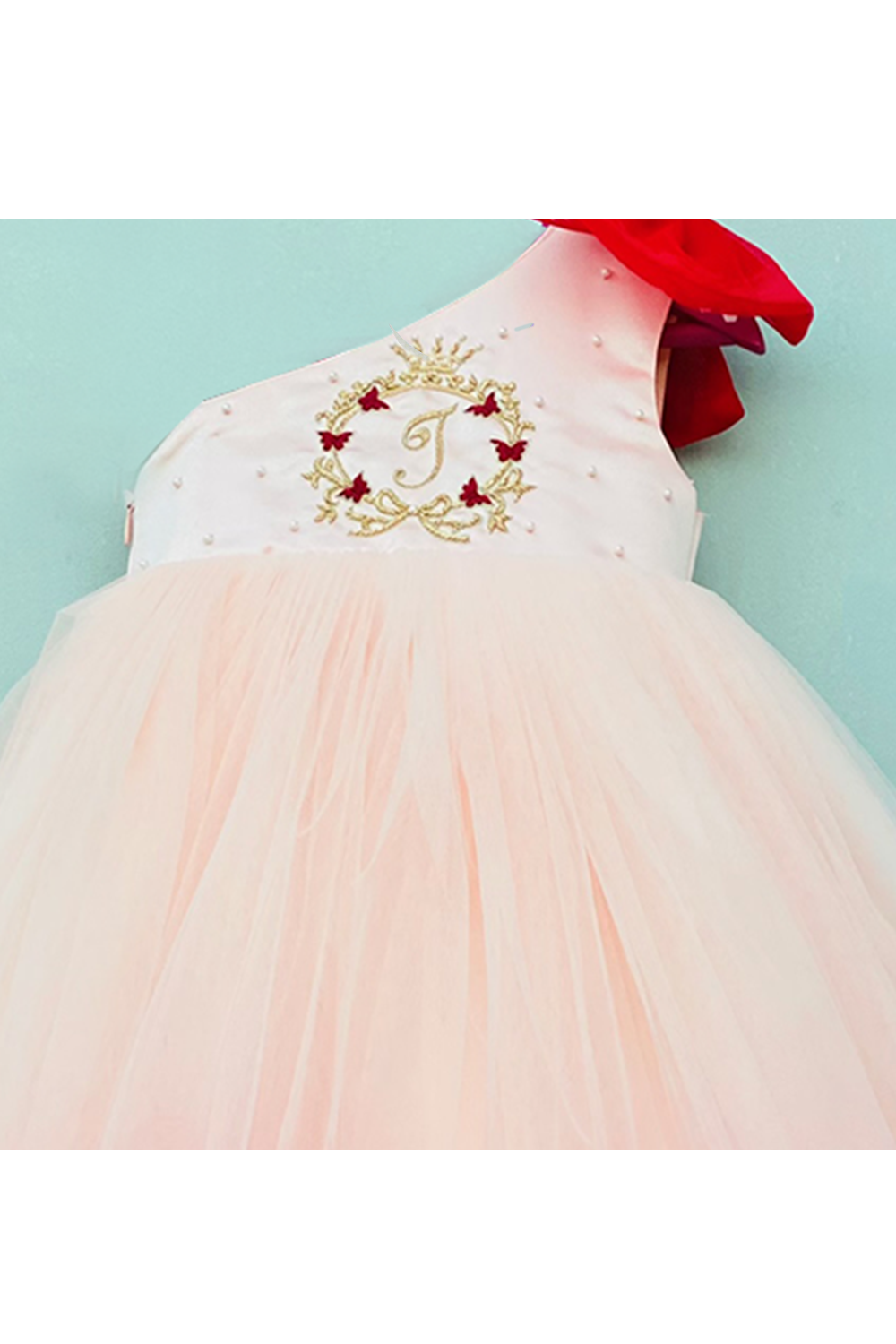 Hand embellished personalised initial monogram in one shoulder gown