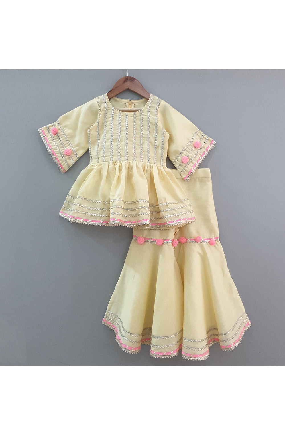 Yellow gota work peplum style kurta with sharara