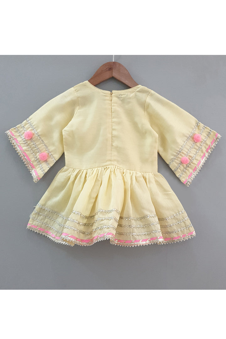 Yellow gota work peplum style kurta with sharara