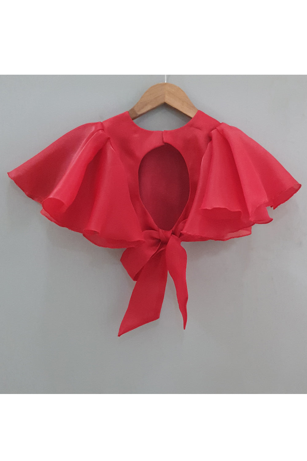 Red frilly sleeves top and printed lehenga with a sling bag