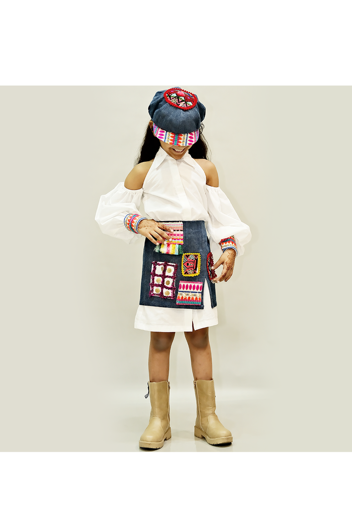 White cold shoulder shirt dress with denim skirt and cap