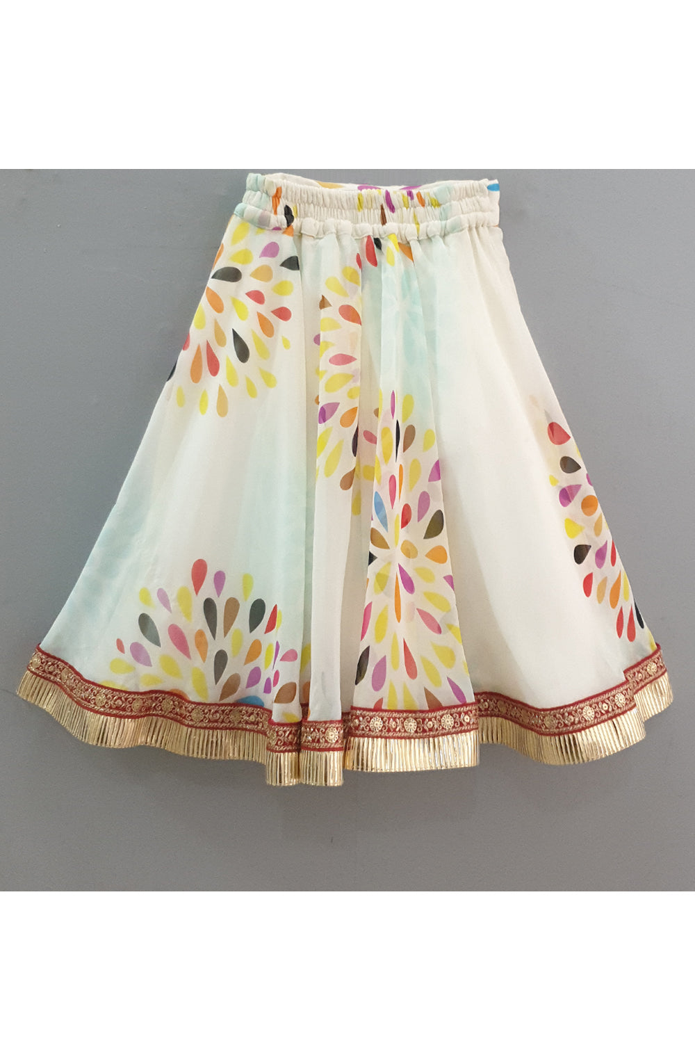 Red frilly sleeves top and printed lehenga with a sling bag