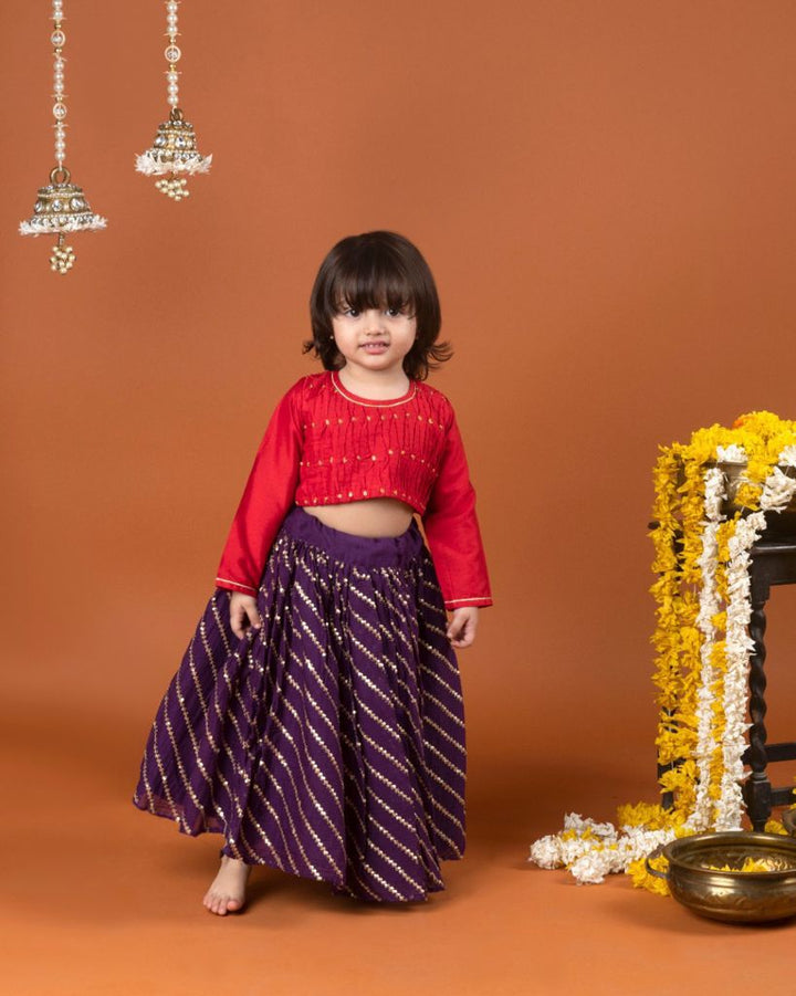 Red smocked tuck top with purple sequined ghagra