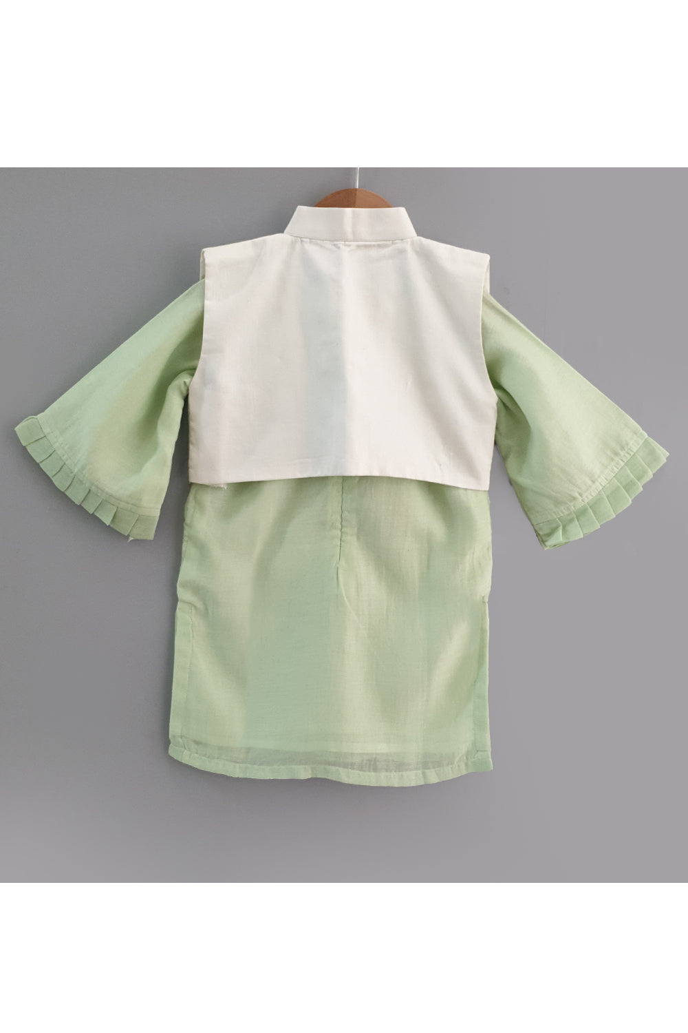 Light green kurta and straight pyjama with embroidered jacket