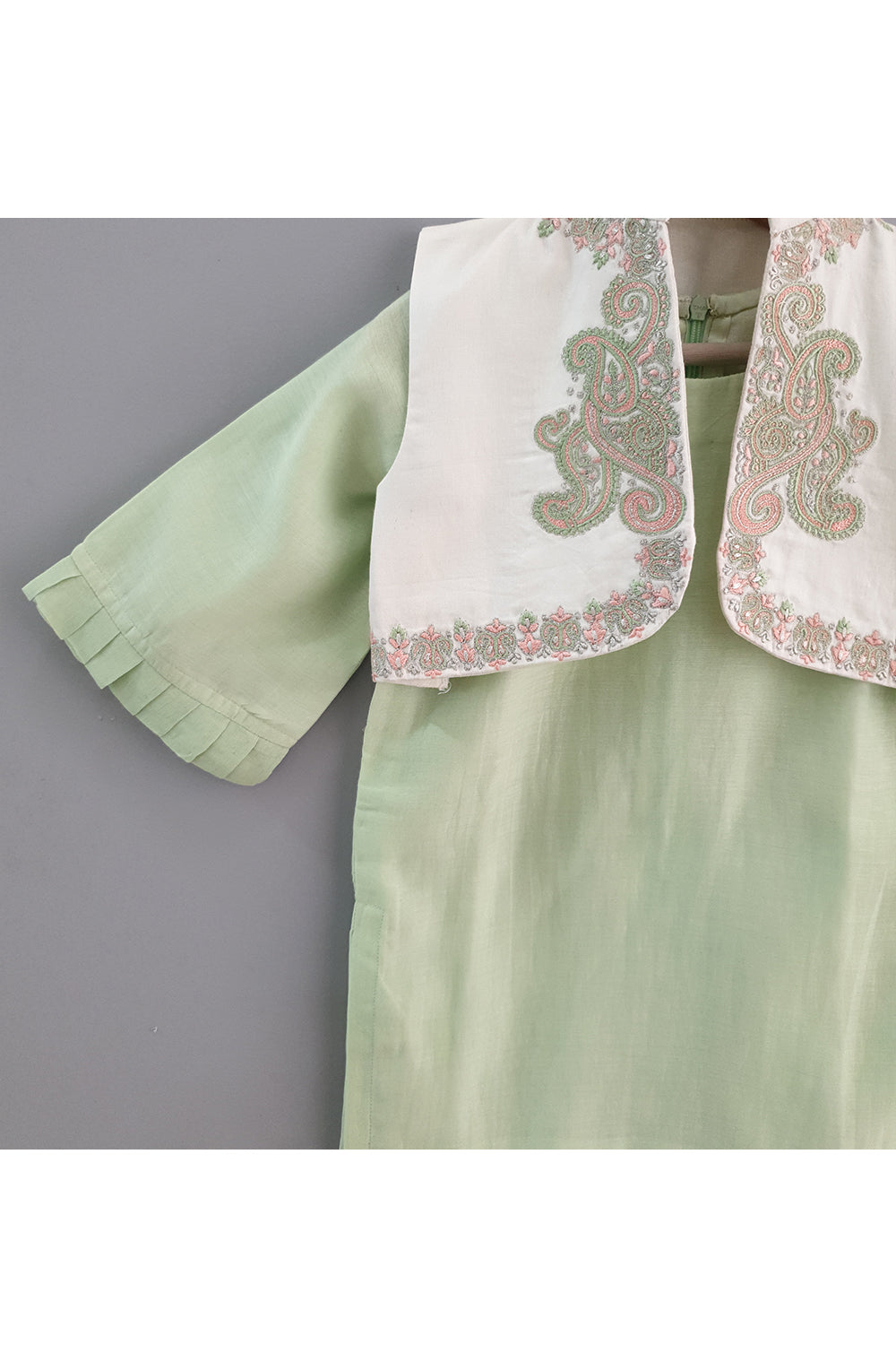 Light green kurta and straight pyjama with embroidered jacket