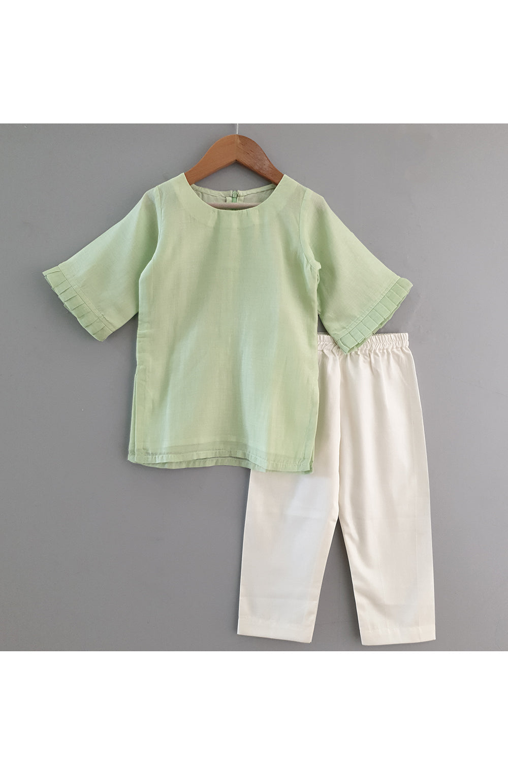 Light green kurta and straight pyjama with embroidered jacket